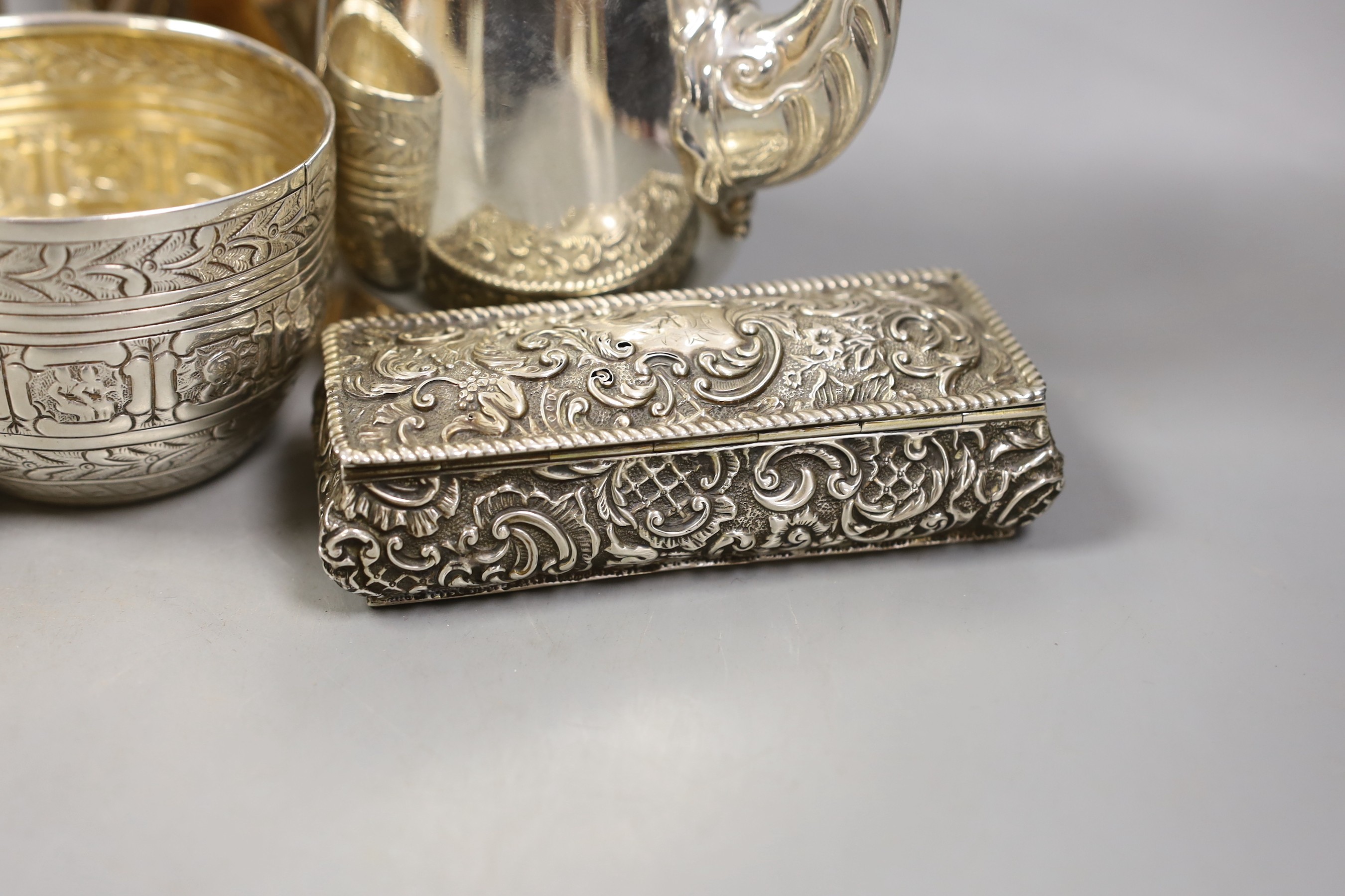 A George V silver coffee pot, London, Carrington & Co 1933, an earlier silver mug by Elkington & Co, a silver sugar caster, cream jug and sugar bowl, a repousse box, pair of silver mounted opera glasses and two plated fr